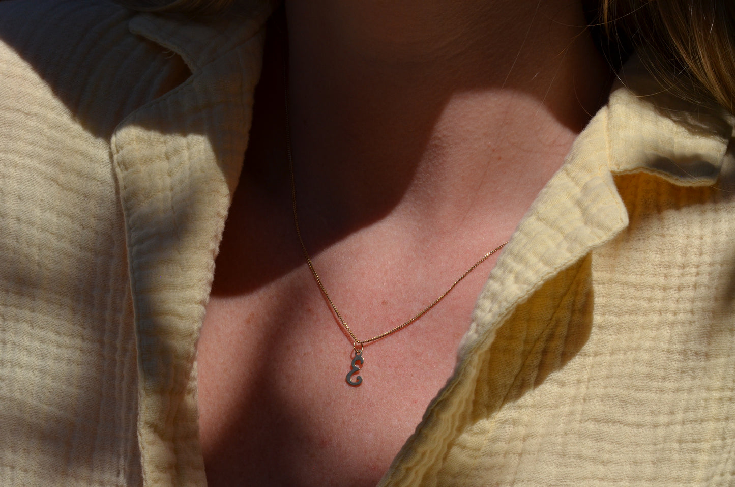 Delicate "E" Charm 1