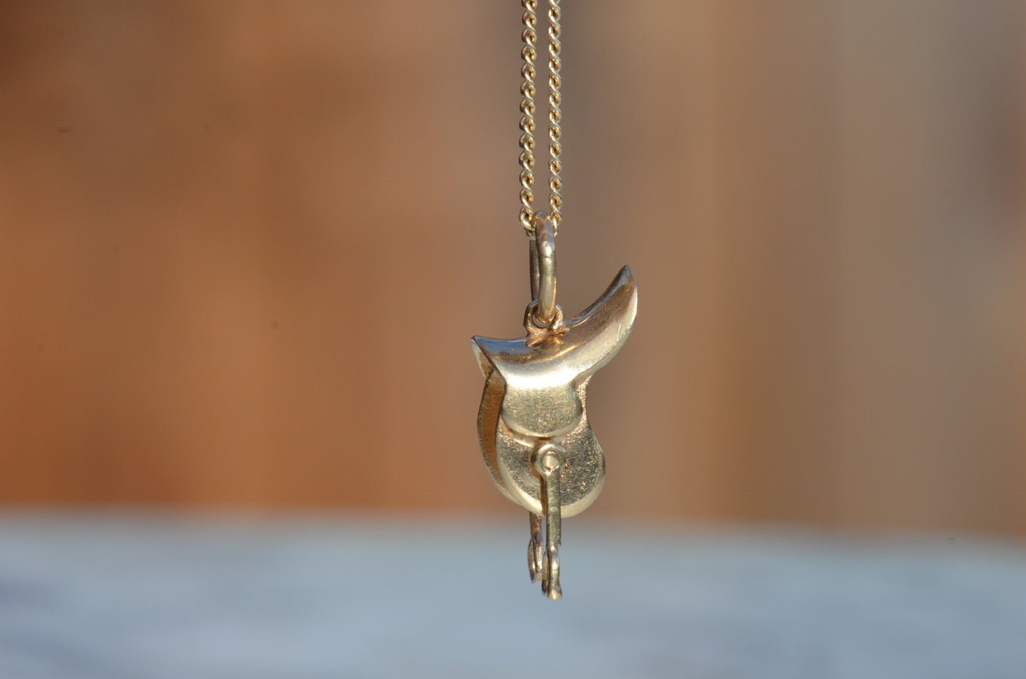 Articulated Midcentury Saddle Charm