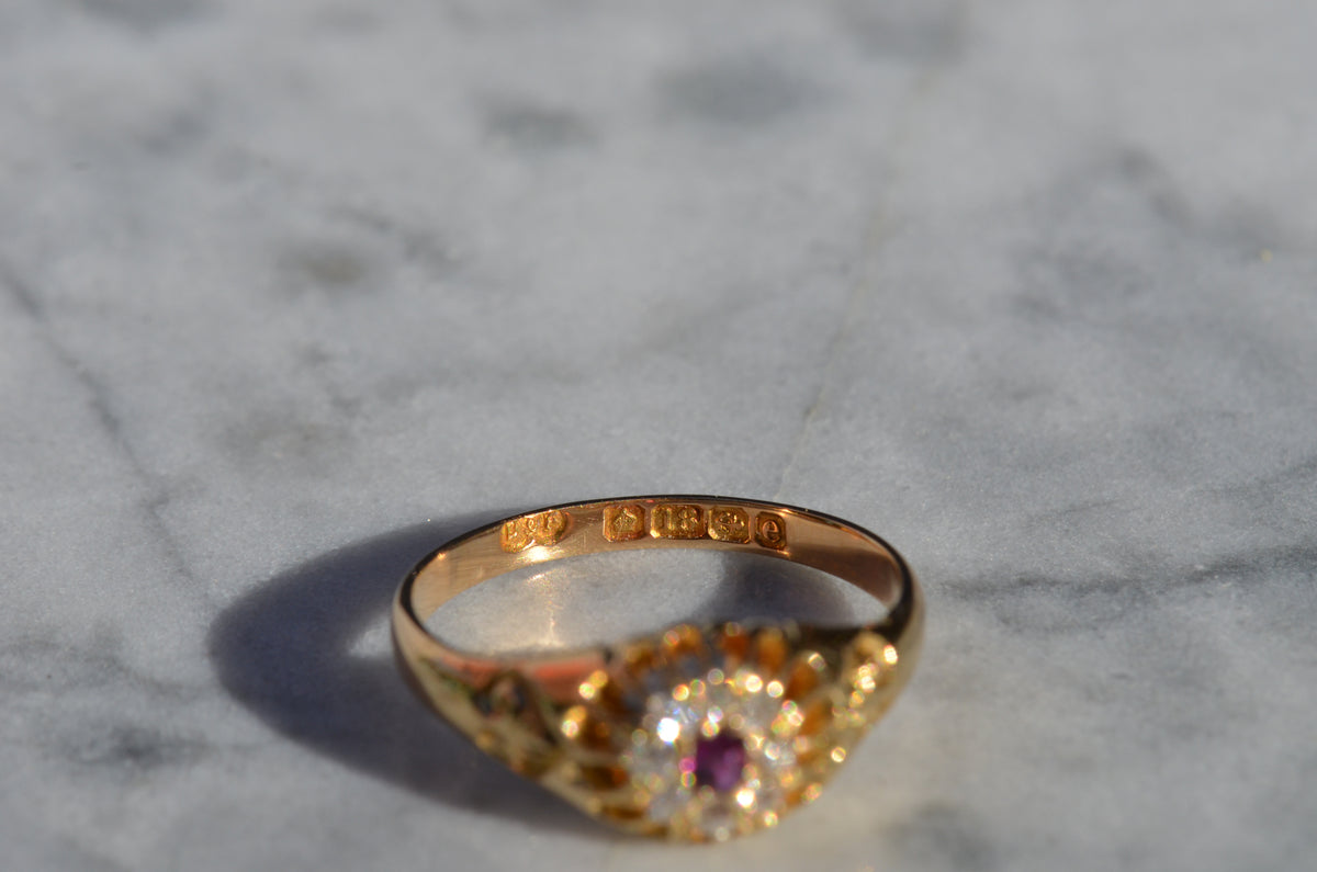 Scintillating Antique Ruby Halo Belcher Ring