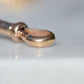 Worn British hallmarks on the outer edge of the dog clip clasp.