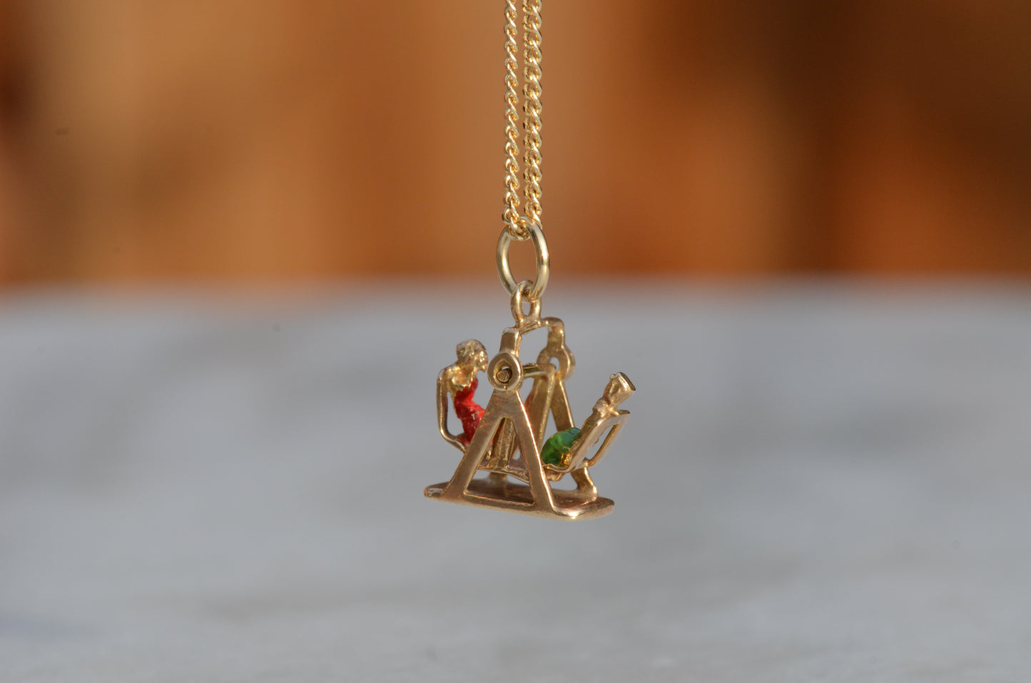 Playful Enameled Swing Charm