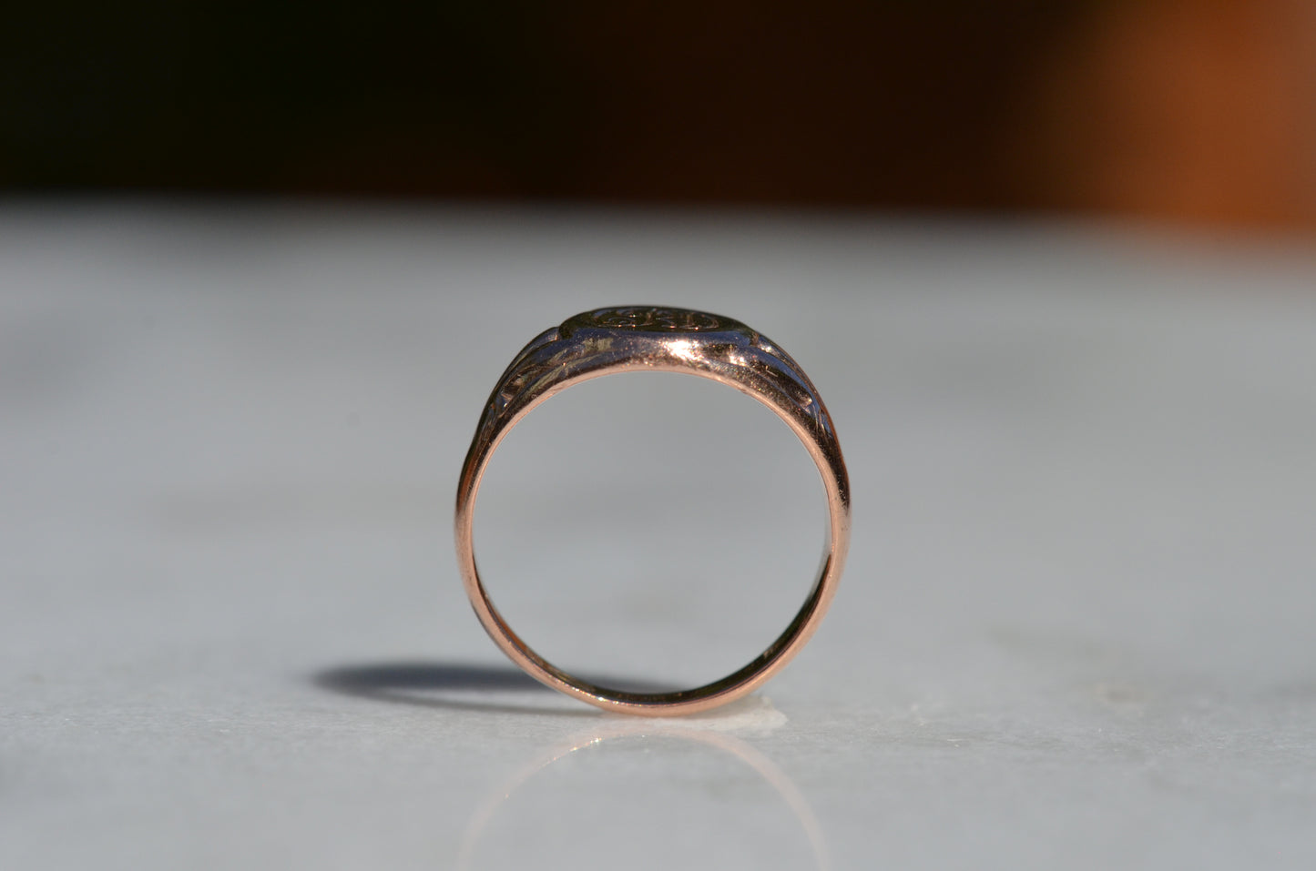 The ring is positioned upright and viewed through the finger hole.