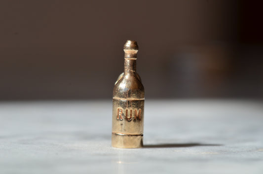Playful Vintage Rum Bottle Charm